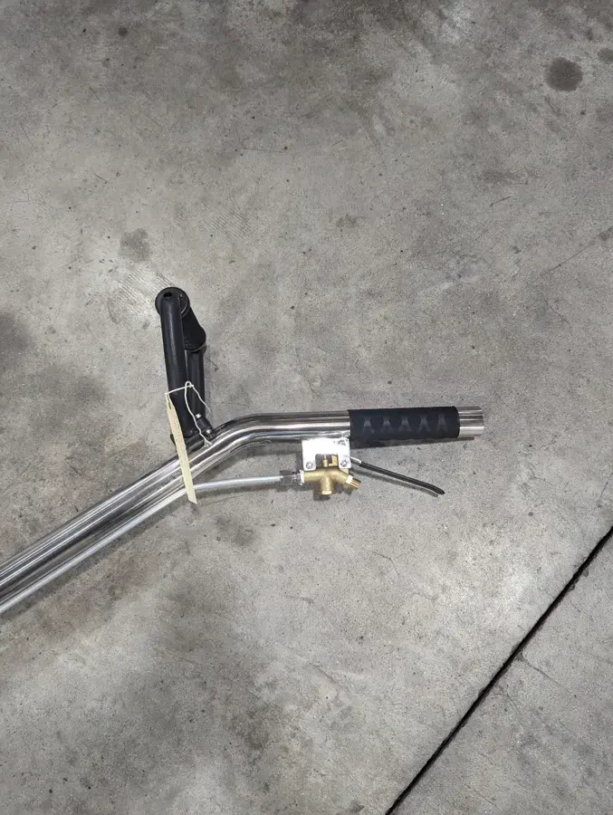 Extraction wand resting on a concrete slab after water removal in El Monte